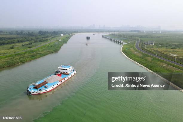 This aerial photo taken on Aug. 16, 2023 shows ships sailing on a new shipping route of a mega water diversion project in east China's Anhui...