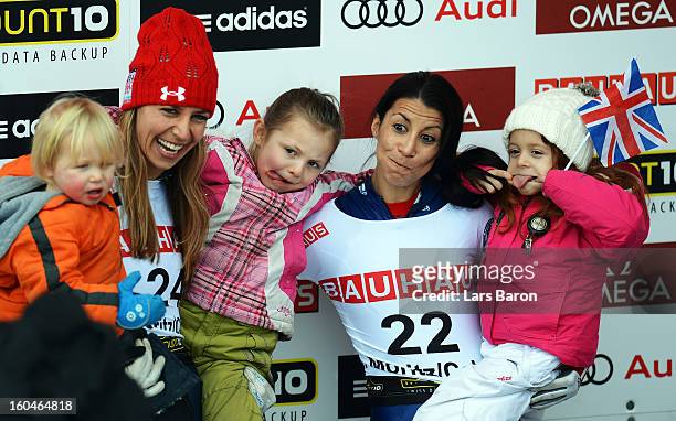 Shelley Rudman of Great Britain celebrates with her daughter Elli next to second placed Noelle Pikus Pace of USA and her kids after winning the...