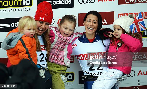 Shelley Rudman of Great Britain celebrates with her daughter Elli next to second placed Noelle Pikus Pace of USA and her kids after winning the...