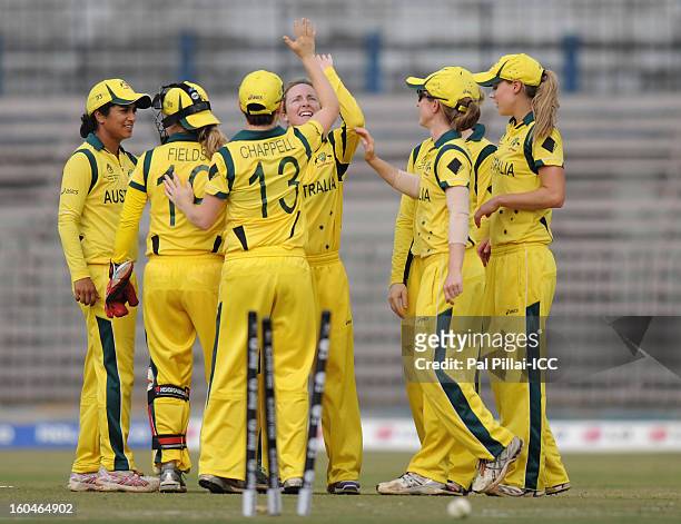 Sarah Coyte of Australia celebrates a wicket with teammates during the second match of ICC Womens World Cup between Australia and Pakistan, played at...