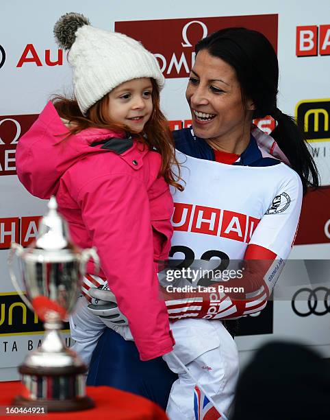 Shelley Rudman of Great Britain celebrates with her daughter Elli after winning the women's skeleton final heat of the IBSF Bob & Skeleton World...