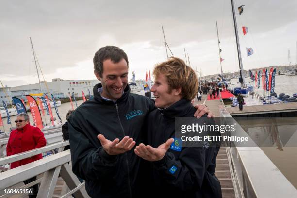 Sailor Francois Gabart with Armel Le Cleac'h after arriving in port after winning the Vendee Globe 2013 record with his boat Macif on January 27,...