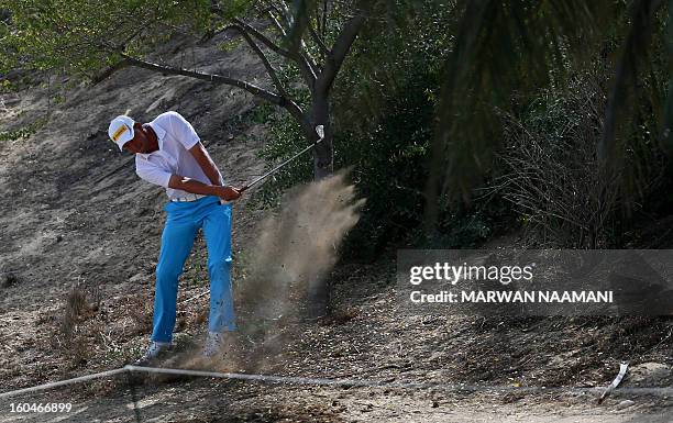 Marcel Seim of Germany plays a shot during the second round of the Dubai Desert Classic golf tournament in the Gulf emirate of Dubai on February 1,...