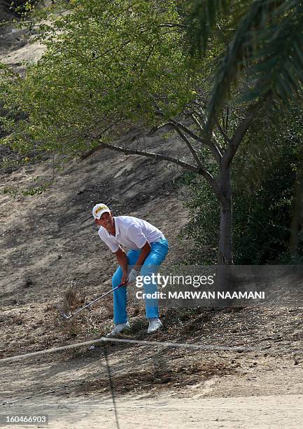 Marcel Seim of Germany gestures before playing a shot during the second round of the Dubai Desert Classic golf tournament in the Gulf emirate of...