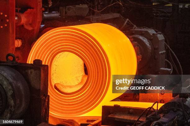 Roll of coiled steel leaves the coil box on the steel production line at the Tata Steel Port Talbot integrated iron and steel works in south Wales on...