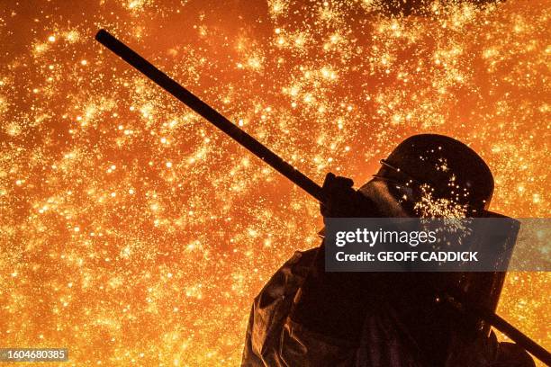 Cast House operator Martin Rees changes the nozzle on a clay gun in Blast Furnace number four at the Tata Steel Port Talbot integrated iron and steel...