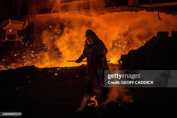 Cast House operator Martin Rees changes the nozzle on a clay gun in Blast Furnace number four at the Tata Steel Port Talbot integrated iron and steel...