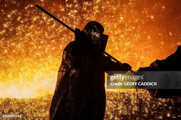 Cast House operator Martin Rees changes the nozzle on a clay gun in Blast Furnace number four at the Tata Steel Port Talbot integrated iron and steel...