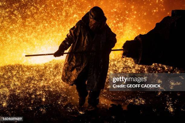 Cast House operator Martin Rees changes the nozzle on a clay gun in Blast Furnace number four at the Tata Steel Port Talbot integrated iron and steel...