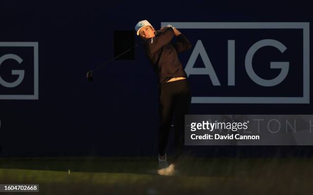Mel Reid of England hits the opening tee shot at 6.30am during the first round of the AIG Women's Open at Walton Heath Golf Club on August 10, 2023...