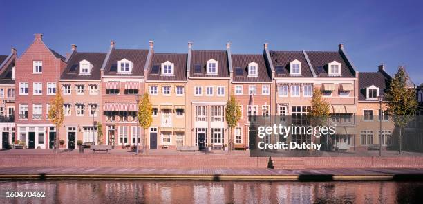 a set of newly built homes, built in the traditional style - nieuwbouw stockfoto's en -beelden