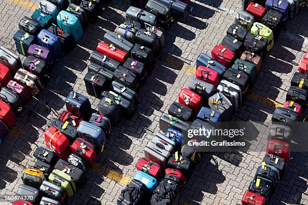 group of suitcases luggage in rows - airport from above stock pictures, royalty-free photos & images