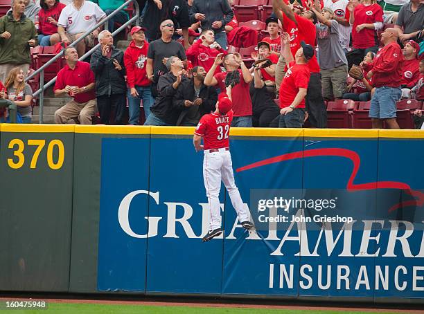 Jay Bruce of the Cincinnati Reds a Carlos Gomez of the Milwaukee Brewers solo home run clear the fence in the top of the third inning during the game...