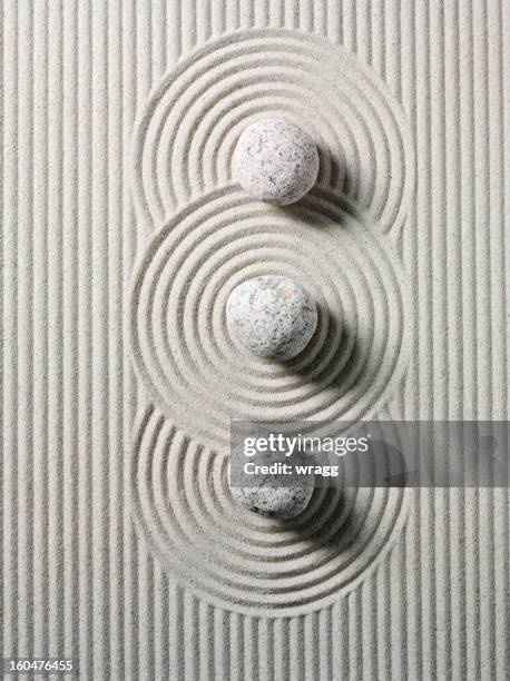 three zen stones and circles - karesansui stock pictures, royalty-free photos & images