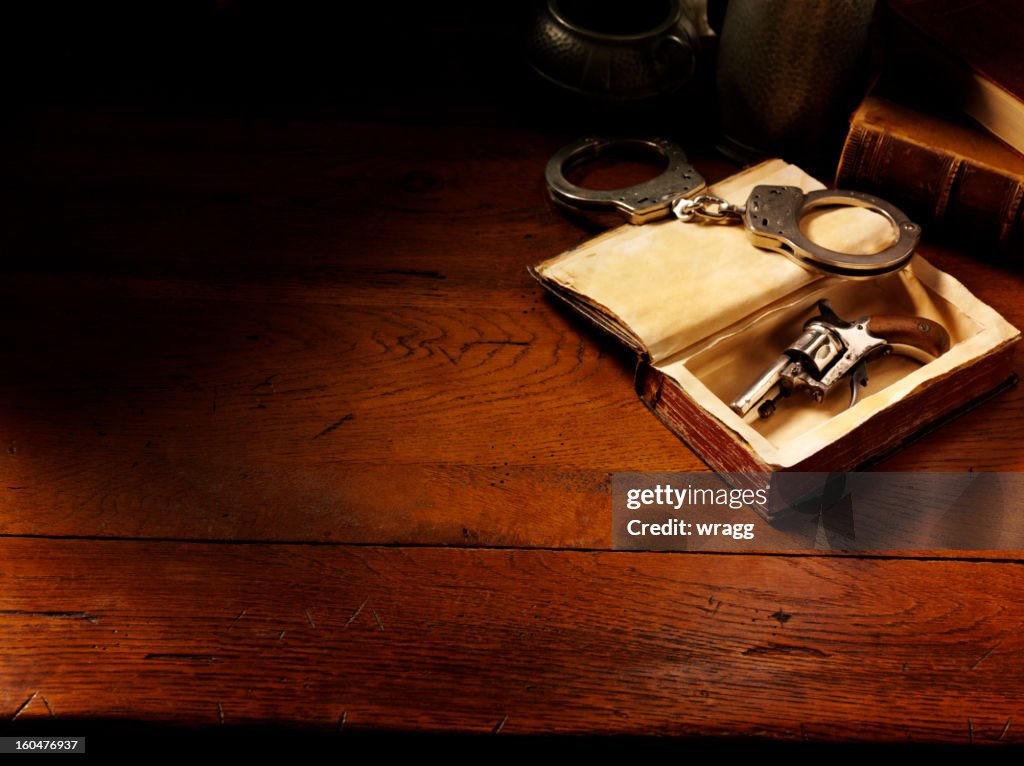 Handcuffs and Handgun in Vintage Style