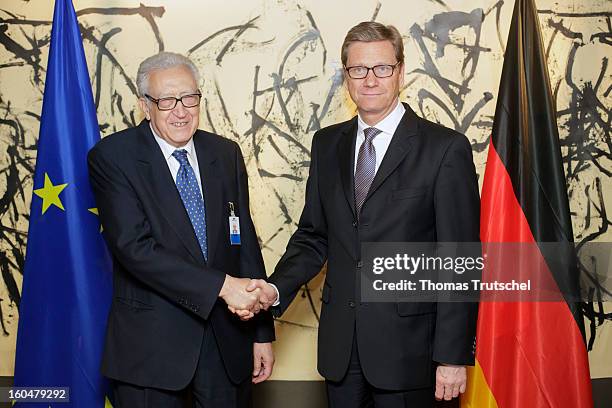 German Foreign Minister Guido Westerwelle and UN-Arab League peace envoy Lakhdar Brahimi, shake hands during a bilateral meeting on day 1 of the 49th...