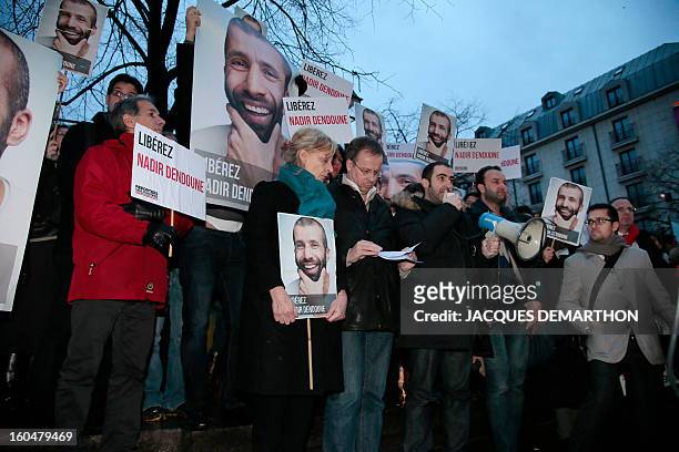 People take part in a demonstration to free French journalist Nadir Dendoune, arrested and detained in Iraq since January 23, in Paris on February 1,...