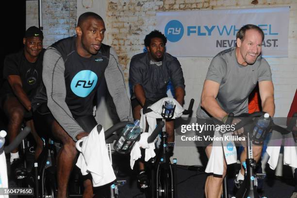 Former NFL players Shannon Sharpe, Dhani Jones and former NFL Coach Bill Cowher attend The Flywheel Challenge at the NFL House hosted by Shannon...