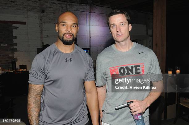 Players Matt Forte and Lawrence Tynes attend The Flywheel Challenge at the NFL House hosted by Shannon Sharpe at The Chicory on February 1, 2013 in...