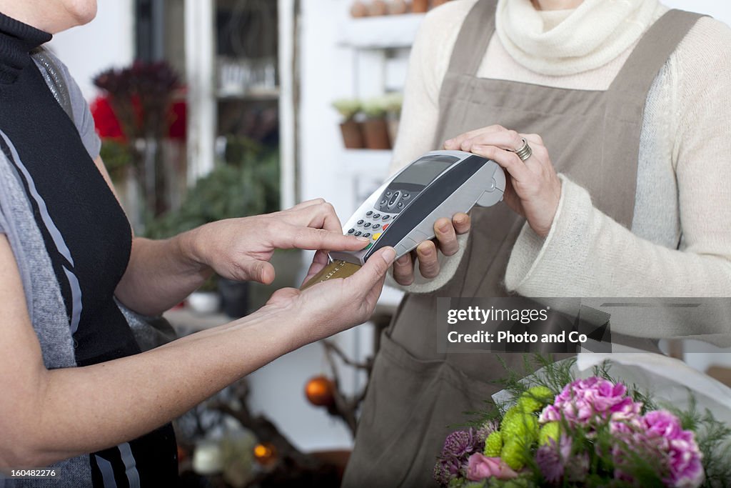 Customer paing flower with credit card