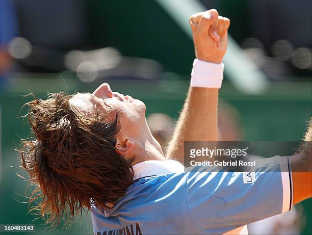 Carlos Berlocq celebrates after defeating Philipp Kohlschreiber in the opening match of the series between Argentina and Germany in the first round...