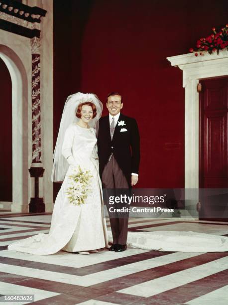 Crown Princess Beatrix of the Netherlands with Claus von Amsberg after their wedding at the Town Hall in Amsterdam, Holland, 10th March 1966.