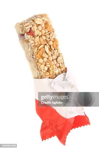 an unwrapped cereal bar on a white background - granola bar wrapper stock pictures, royalty-free photos & images