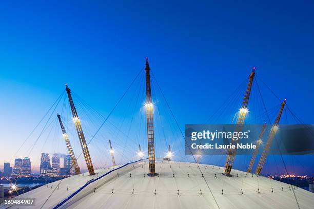 o2 arena and canary wharf illuminated at dusk - the o2 england stock pictures, royalty-free photos & images