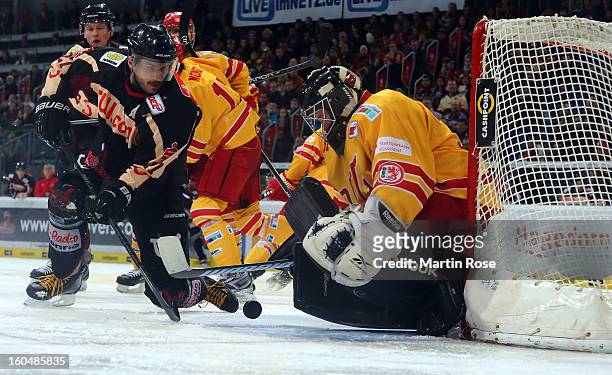 Iva Ciernik of Hannover fails to score over Felix Bick , goaltender of Duesseldorf during the DEL match between Hannover Scorpions and Duesseldorfer...