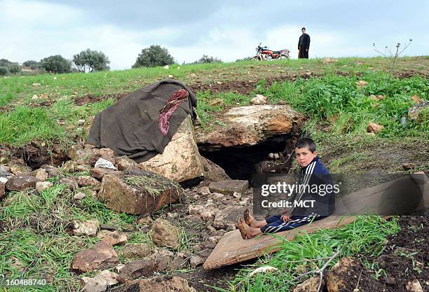 Cave outside the village of al Sahriah, north of Hama, is where this family of 16 is now living. They fled from nearby Kifrimboudah, which is now...