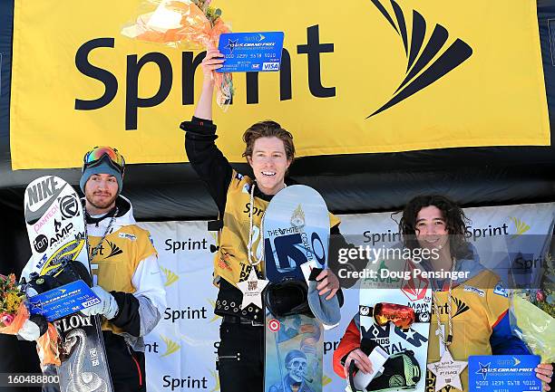 Scotty Lago of the USA in second place, Shaun White of the USA in first place and Luke Mitrani of the USA in third place take the podium for the...