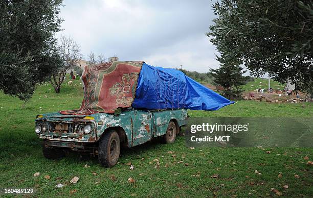 Outside the village of al Sahriah, north of Hama, Syria, a family of 10 fleeing the government's bombardment of their village brought their shelter...