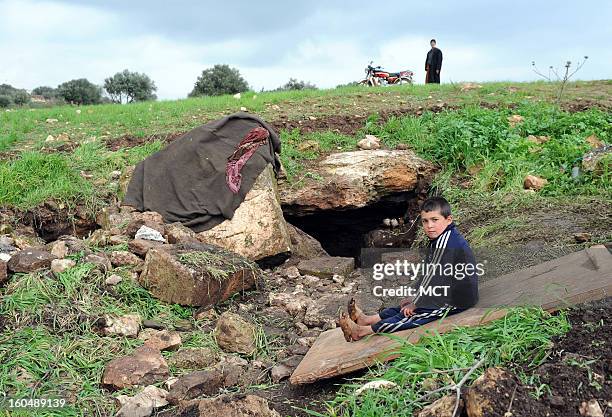 Cave outside the village of al Sahriah, north of Hama, is where this family of 16 is now living. They fled from nearby Kifrimboudah, which is now...