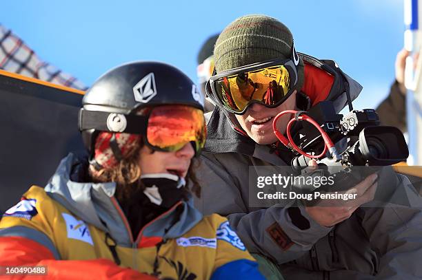 Mike Jankowski Head Coach of the US Snowboarding & US Freeskiing Halfpipe & Slopestyle Team talks with Luke Mitrani during practice as he finished...