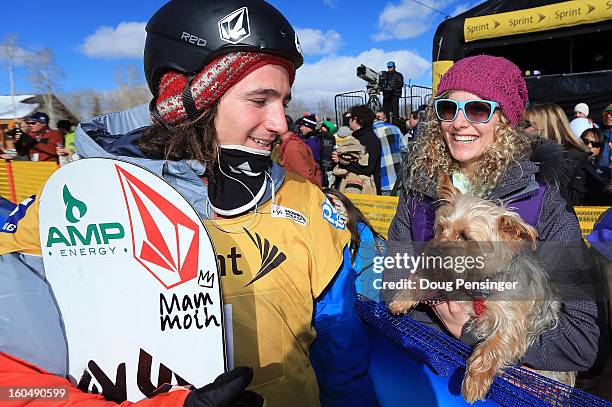 Luke Mitrani talks with Lindsey Jacobellis of the US Snowboardcross Team and her dog Gidget after Mitrani finished third in the FIS Snowboard...