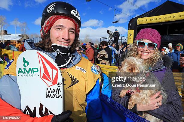 Luke Mitrani talks with Lindsey Jacobellis of the US Snowboardcross Team and her dog Gidget after Mitrani finished third in the FIS Snowboard...