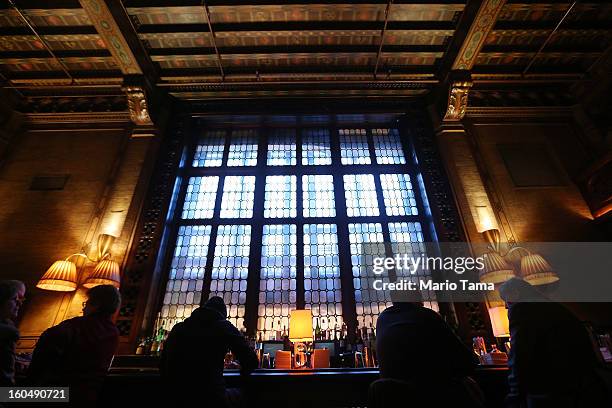 People gather at the Campbell Apartment at Grand Central Terminal during celebrations on the day the famed Manhattan transit hub turns 100 years old...