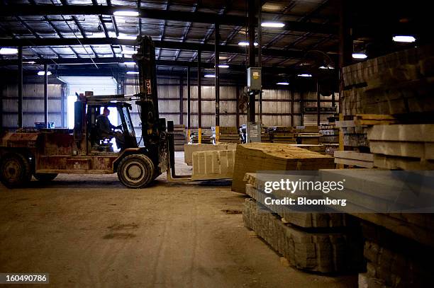 Worker uses a forklift to stack slabs of sandstone at the Cleveland Quarries facility in Vermilion, Ohio, U.S., on Friday, Feb. 1, 2013. Spending on...