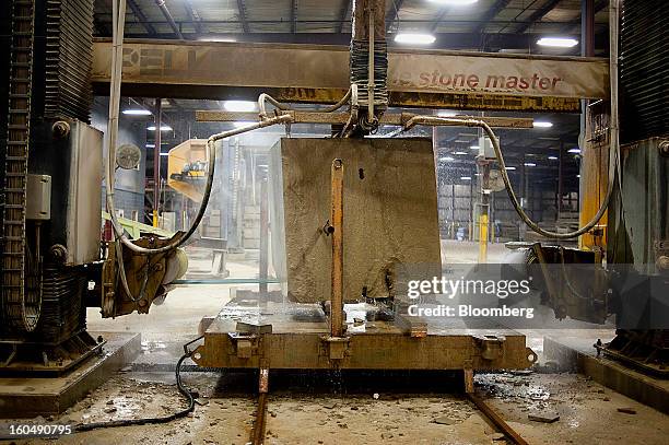 Wire saw makes multiple cuts in a block of sandstone at the Cleveland Quarries facility in Vermilion, Ohio, U.S., on Friday, Feb. 1, 2013. Spending...