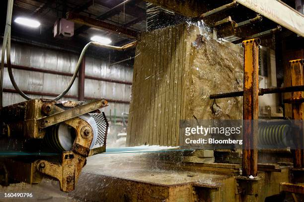 Wire saw makes multiple cuts in a block of sandstone at the Cleveland Quarries facility in Vermilion, Ohio, U.S., on Friday, Feb. 1, 2013. Spending...