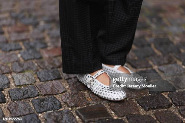 Karin Teigl seen wearing Munthe dark grey checked suit pants, Alaia white leather studded rhinestones ballerinas, during the Copenhagen Fashion Week...