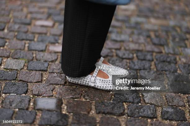 Karin Teigl seen wearing Munthe dark grey checked suit pants, Alaia white leather studded rhinestones ballerinas, during the Copenhagen Fashion Week...