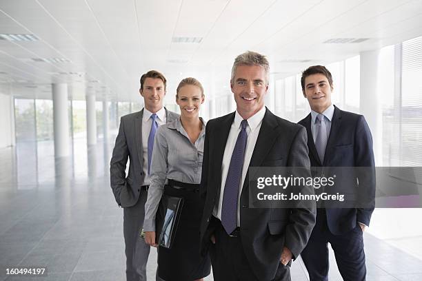 business-team im büro-gebäude - four people stock-fotos und bilder