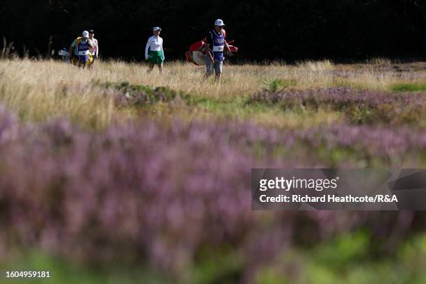 Charley Hull of England and Lydia Ko of New Zealand walk on the 4th hole on Day One of the AIG Women's Open at Walton Heath Golf Club on August 10,...
