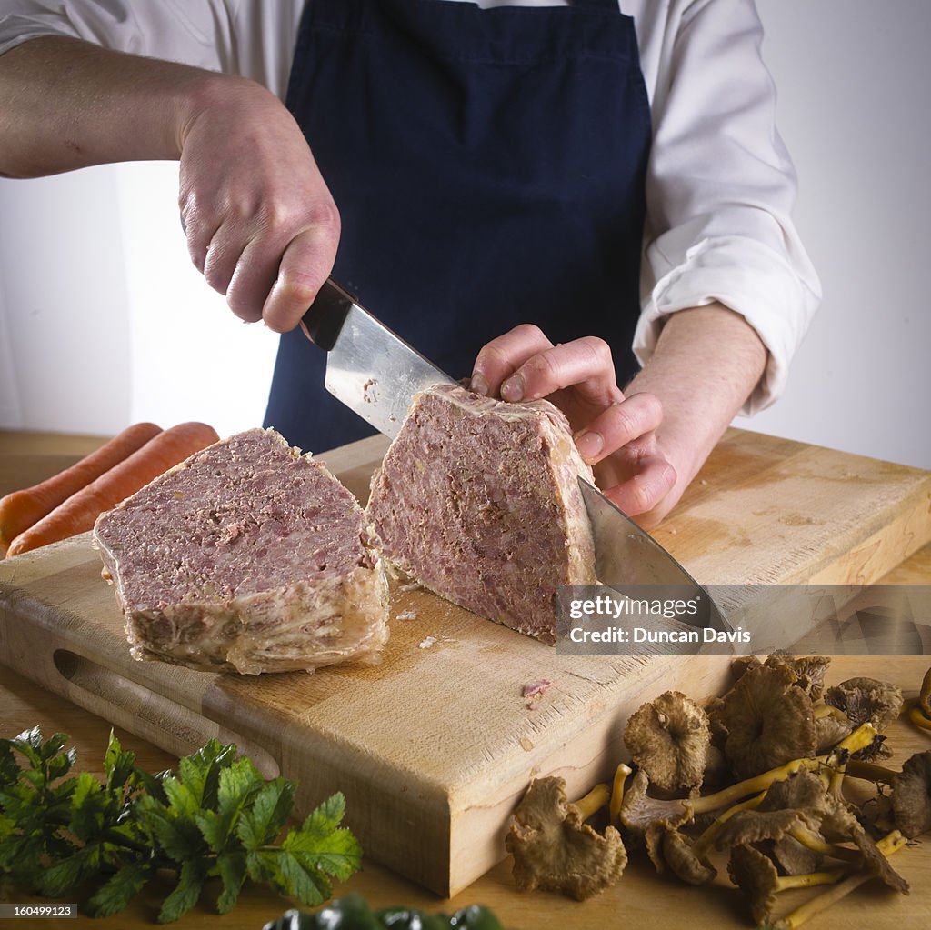Chef Cutting Ingredients On Chopping Board High-Res Stock Photo - Getty ...
