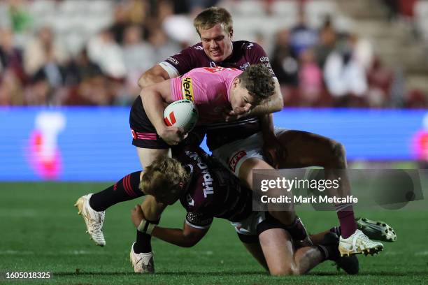 Liam Martin of the Panthers is tackled during the round 24 NRL match between Manly Sea Eagles and Penrith Panthers at 4 Pines Park on August 10, 2023...