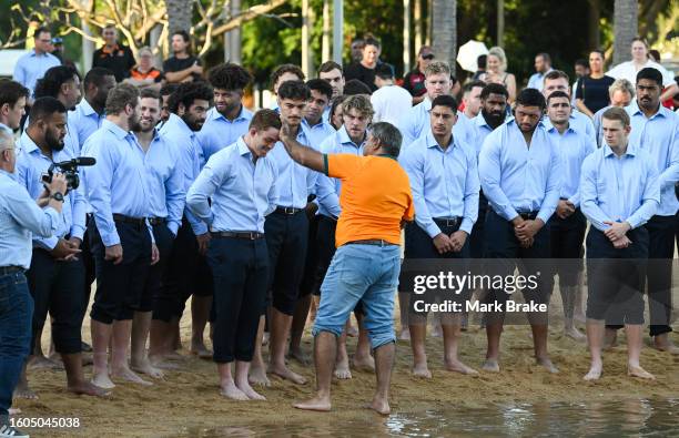 Local elder Richard Fejo performs the Saltwater ceremony from the Larrakia Nation to Wallabies players during the Australia Wallabies Rugby World Cup...