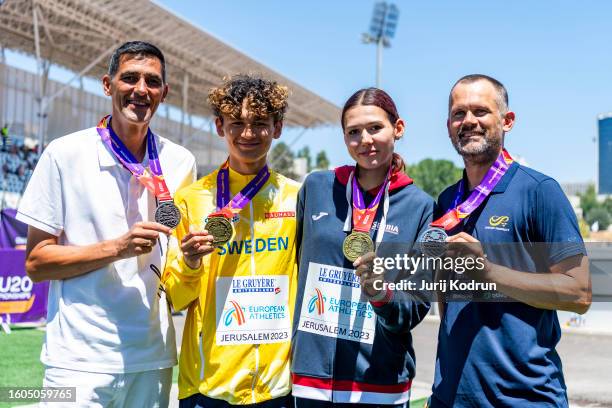 Gold medal winner in Women's High Jump Angelina Topic of Serbia and gold medal winner in Men's High Jump Melwin Lycke Holm pose with their fathers...