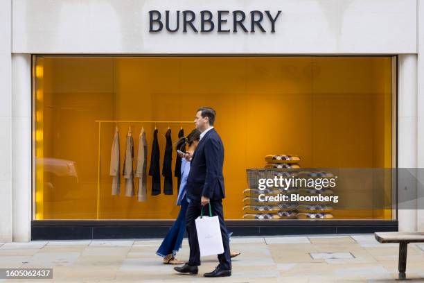 Jackets on display in the window of the Burberry Group Plc luxury boutique on Bond Street in London, UK, on Thursday, Aug. 17, 2023. The Office for...