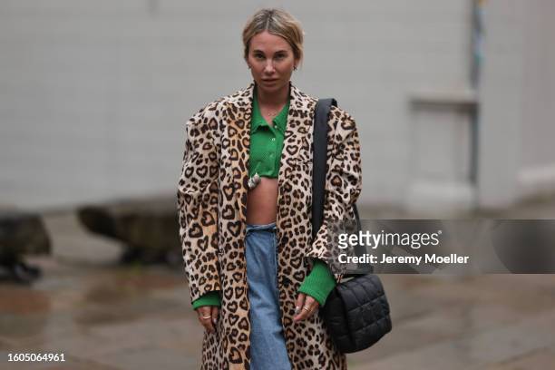 Karin Teigl seen wearing Milk White green knit cropped top with long sleeves, H&M beige / brown leopard pattern long coat, black rose hair clip, Vee...